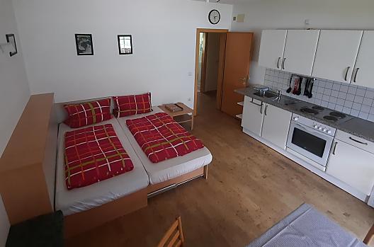 Onze woonkeuken met een tweepersoonsbedfunctie