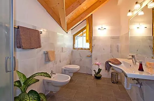 Badkamer van het vakantieappartement Ritten